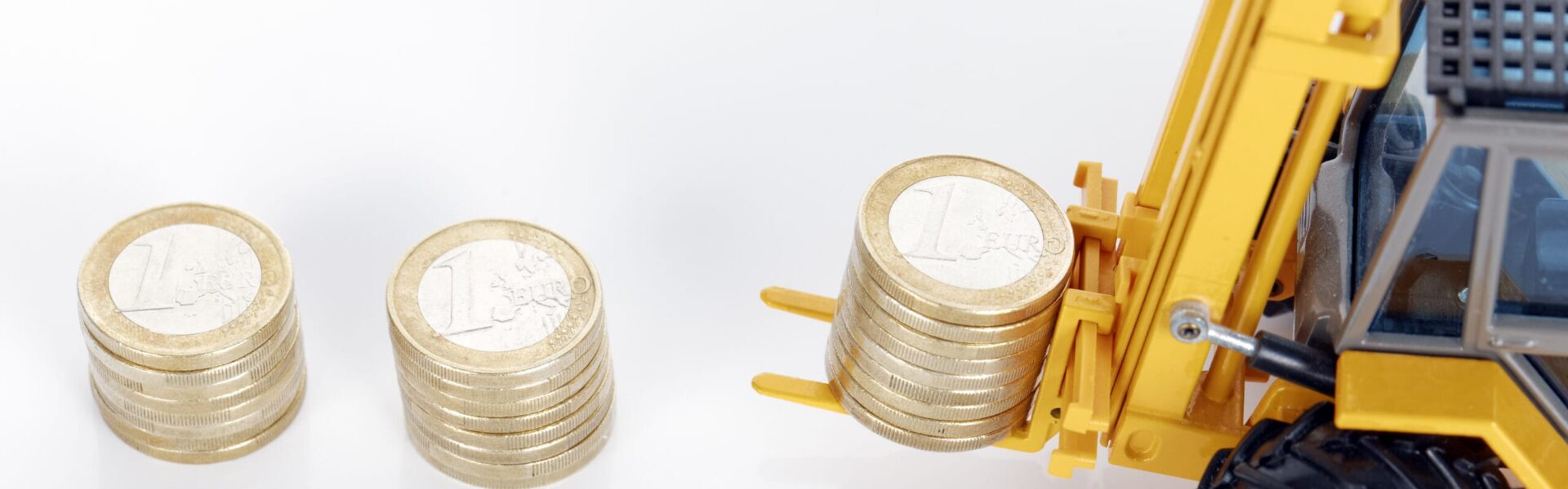euro money coins and forklift on white background